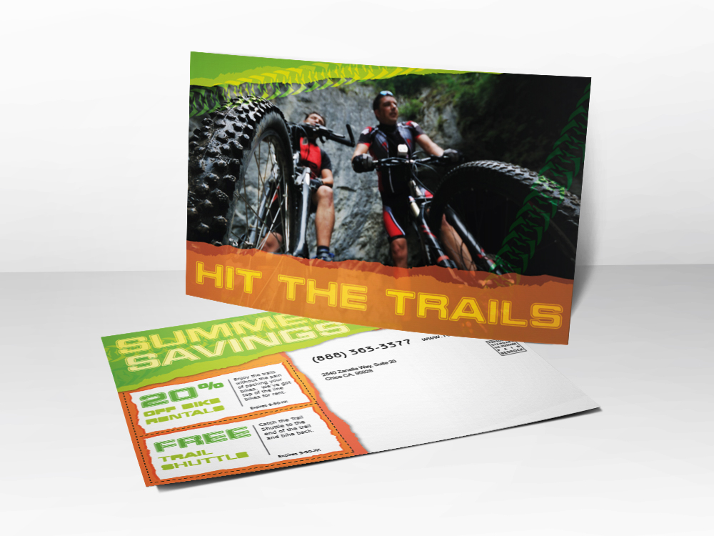 An advertising postcard for companies that sell road bikes and mountain bikes with a picture of two guys mountain biking.